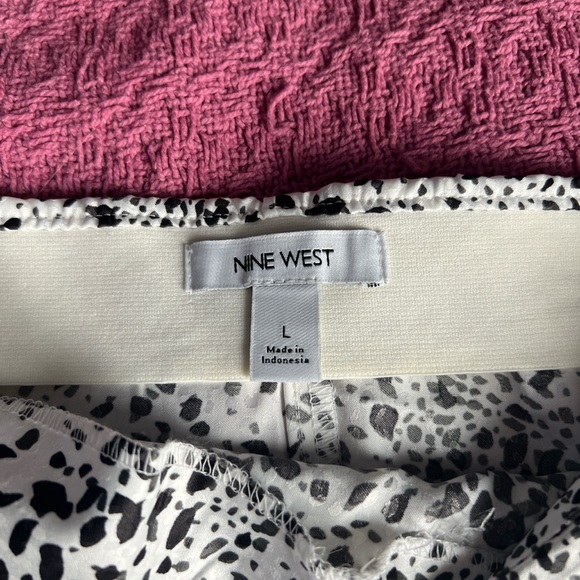 Black and white animal print midi skirt with a satin ish feel to it. - Picture 4 of 5